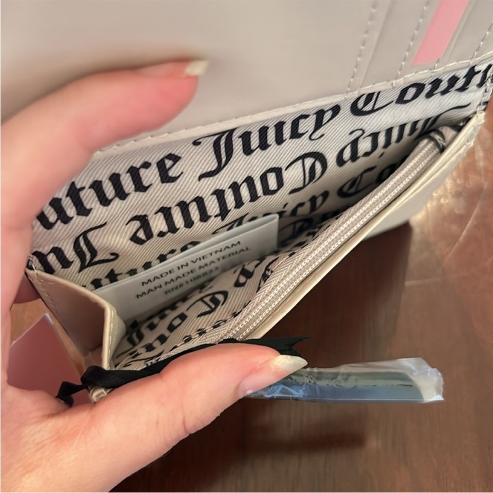 Juicy Couture Flawless Slim Elongated
Licorice Bifold - Picture 7 of 10